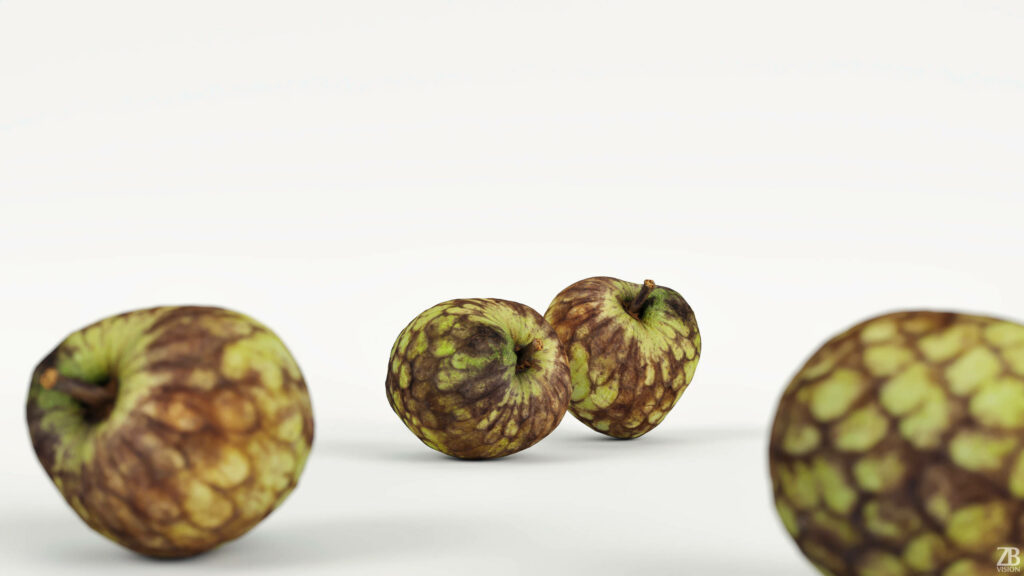 Three cherimoya fruits with textured green brown skin on white minimalistic background wallpaper