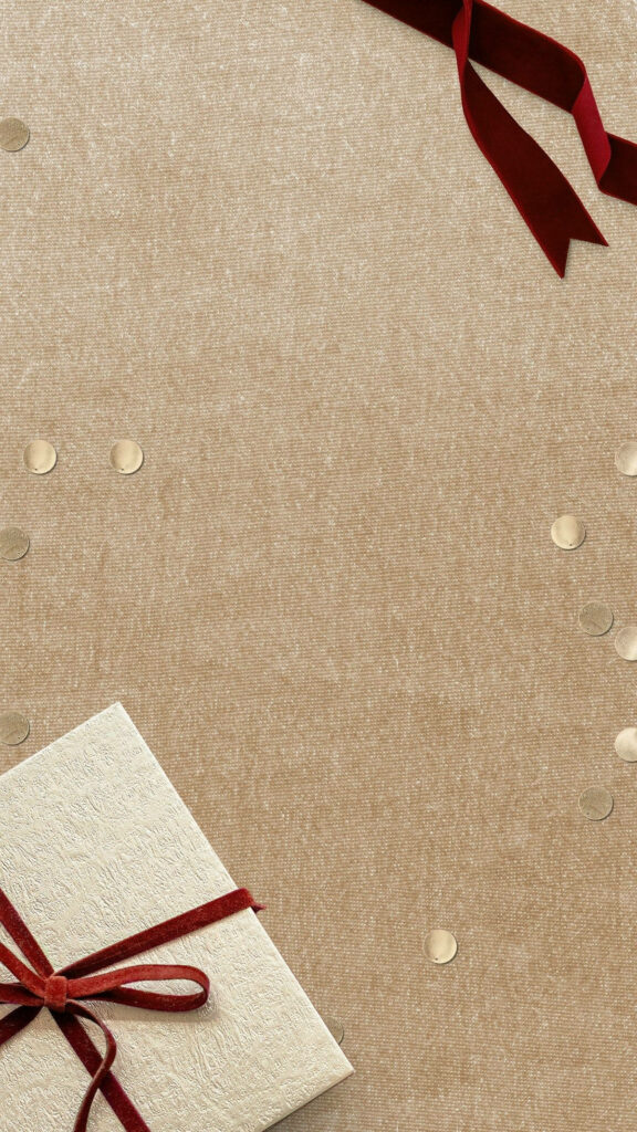 Minimalist Christmas Wallpaper: Beige Background with Red Ribbon Gift