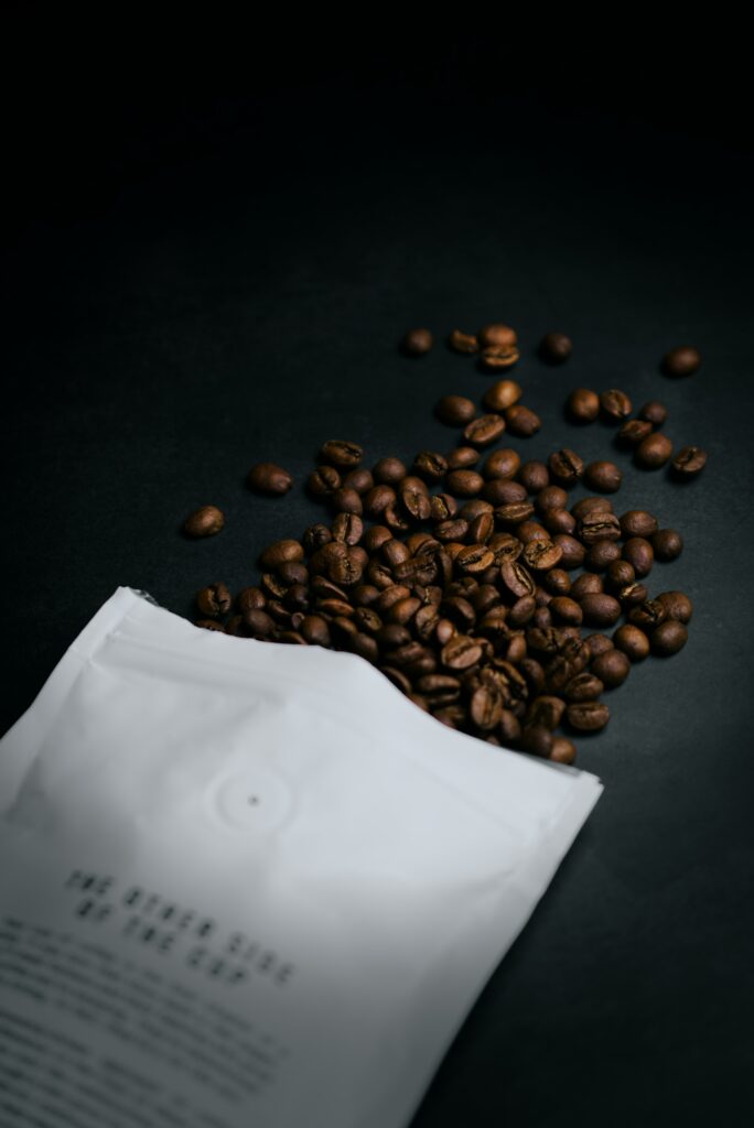 Minimalist Coffee Beans Wallpaper: Rich Textures on Dark Surface