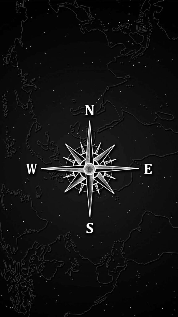 Minimalist compass wallpaper with white compass rose on dark textured map background design