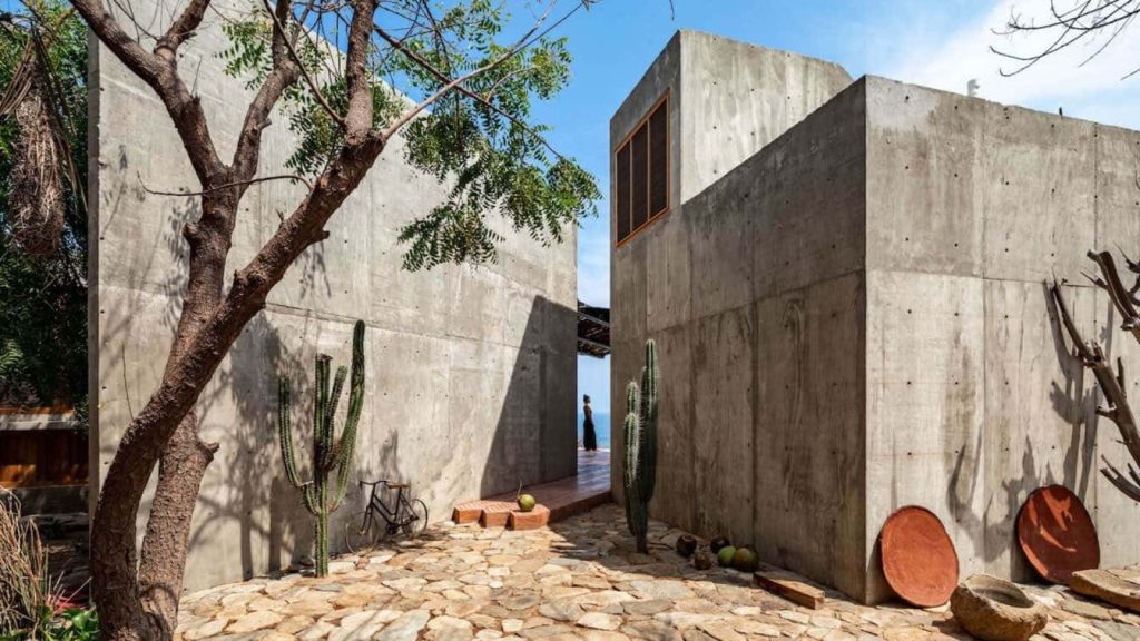 Minimalist concrete resort wallpaper with brutalist architecture desert cacti rustic courtyard bicycle