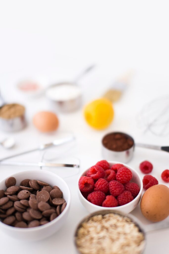 Minimalistic Baking Wallpaper: Chocolate Chips & Fresh Raspberries