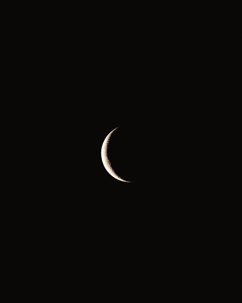 Serene Minimalist Wallpaper: Crescent Moon & Dark Sky Background