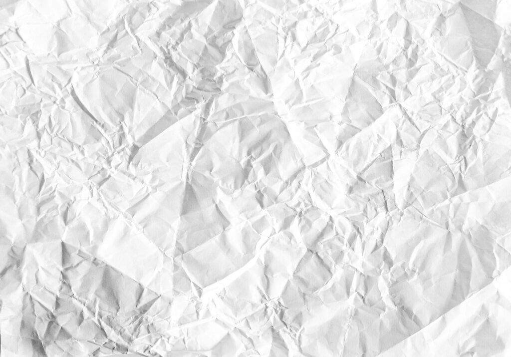 Minimalist Crumpled White Paper Texture Wallpaper for Creative Designs