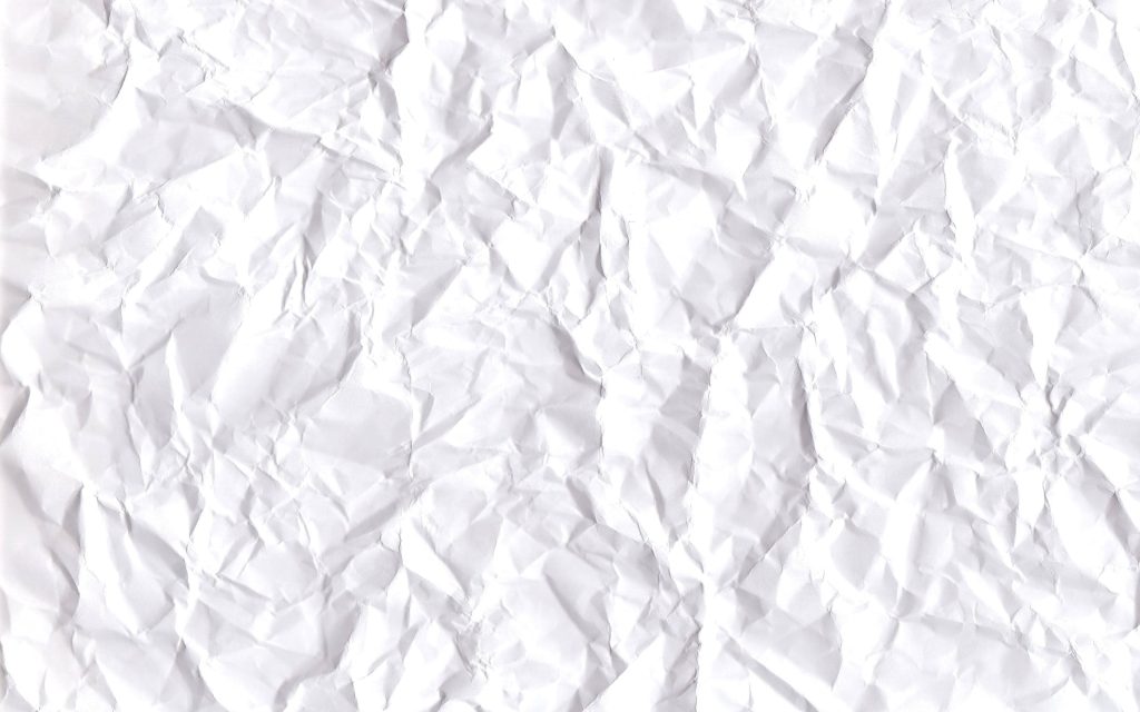 Minimalist crumpled white paper texture with soft shadows and distinct creases background Wallpaper