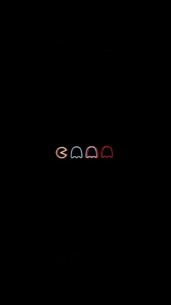 Minimalist dark wallpaper with neon Pac-Man and three ghosts retro gaming design for tablet