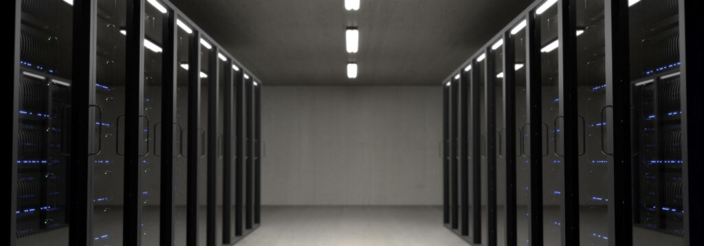 Minimalist data center with black server racks blue lights linear overhead lighting modern design Wallpaper