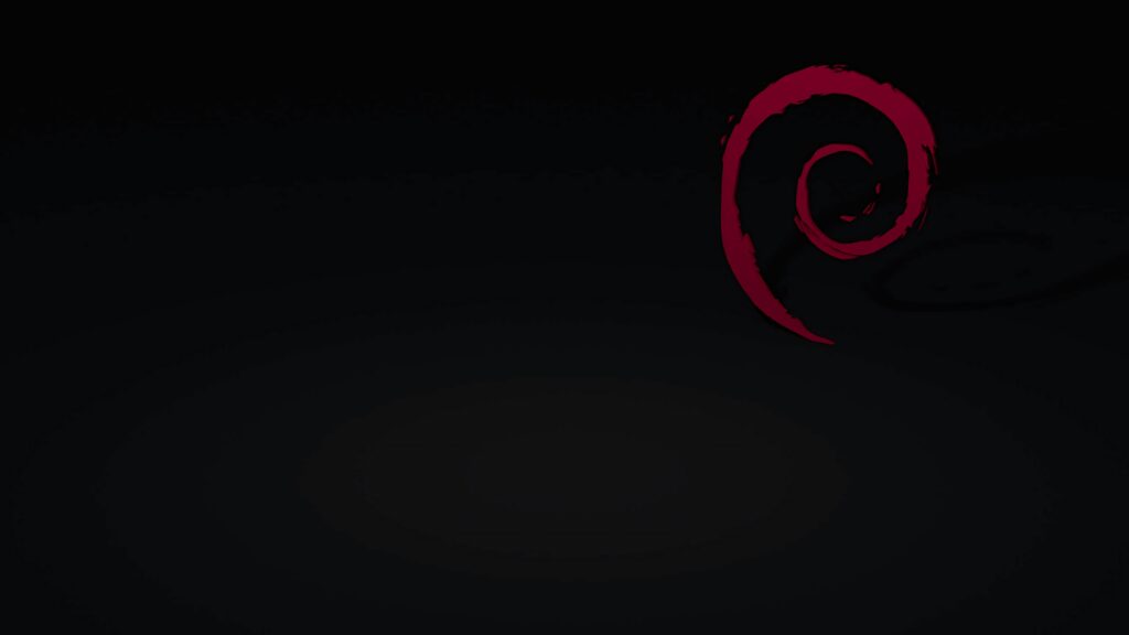 Minimalist Debian wallpaper with black background and red swirl logo in upper right corner