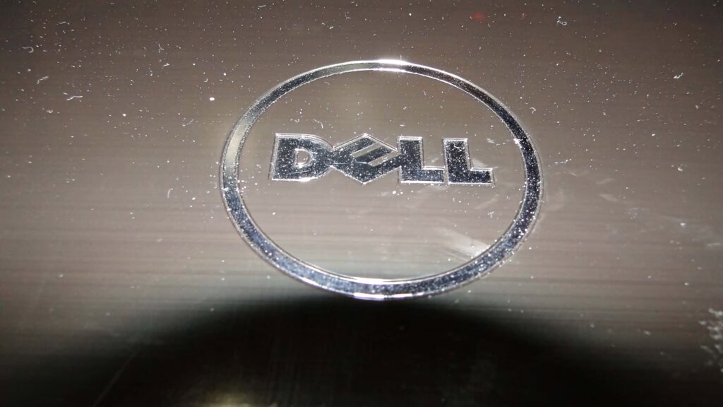 Dell wallpaper minimalist dark background with centered metallic ring logo sleek professional design