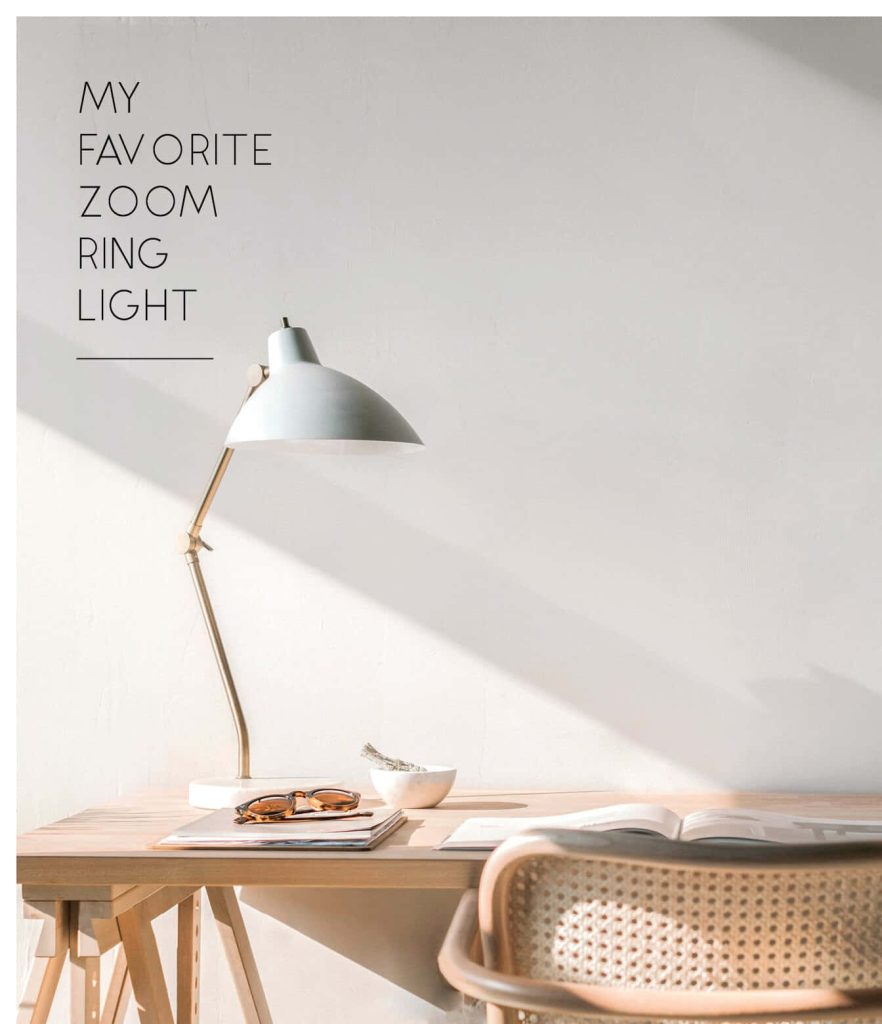 Minimalist desk setup with modern lamp bright sunlight and serene wall perfect Zoom background Wallpaper