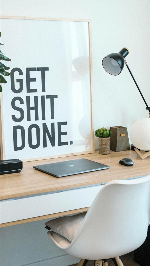 Minimalist Desk Setup with Motivational Poster - Clean Workspace Wallpaper