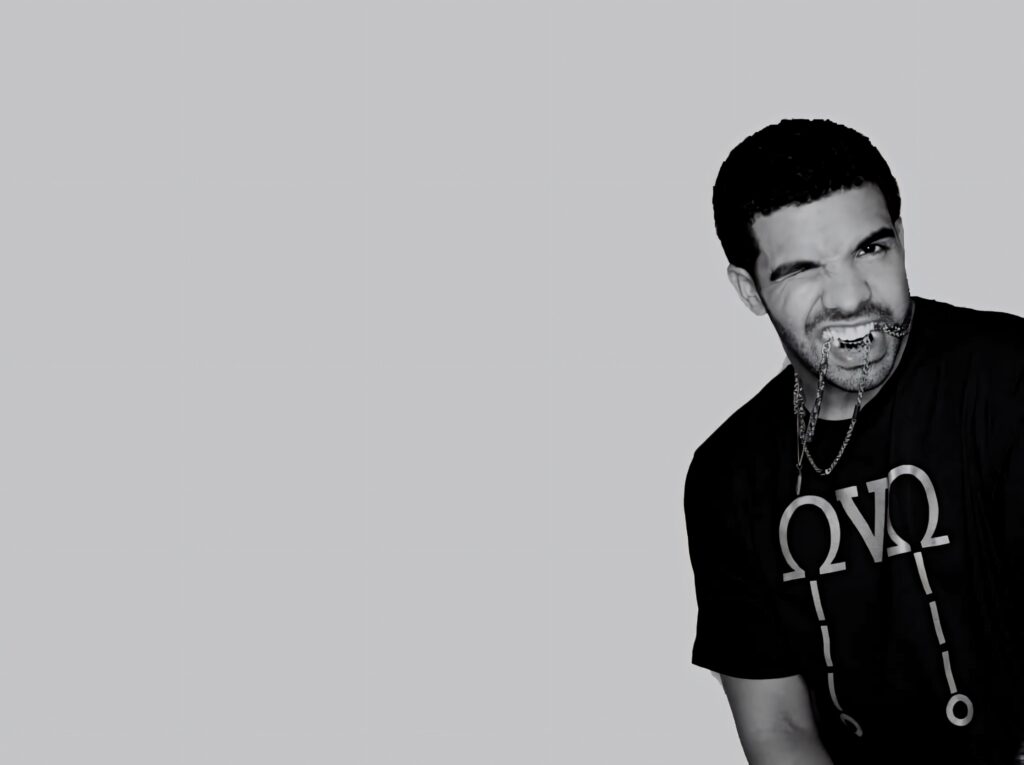 Minimalist Drake Wallpaper: Bold Pose on Simple Gray Background