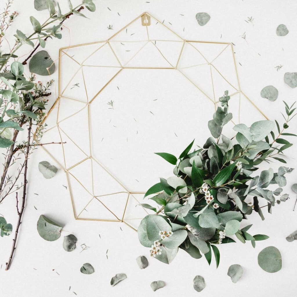 Unfinished eucalyptus wreath with gold geometric frame white berries minimalist botanical decor Wallpaper