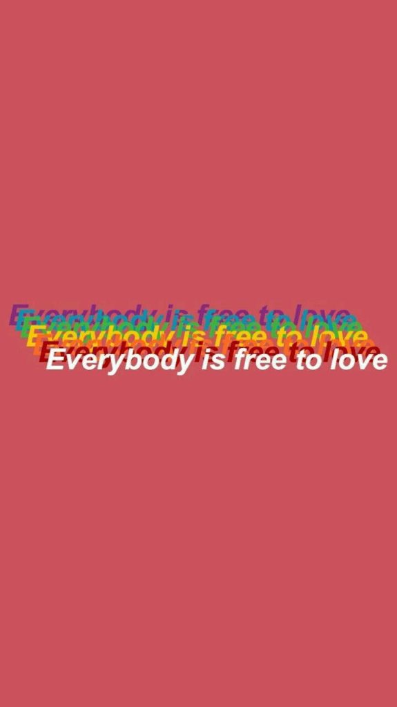 Minimalist wallpaper with glitch text Everybody is free to love on muted pink LGBT background