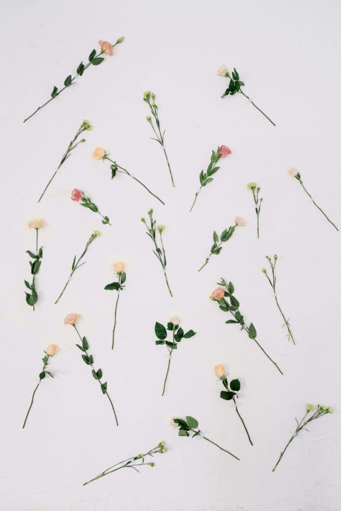 Minimalist Floral Wallpaper: Serene Pastel Flowers on Textured Background