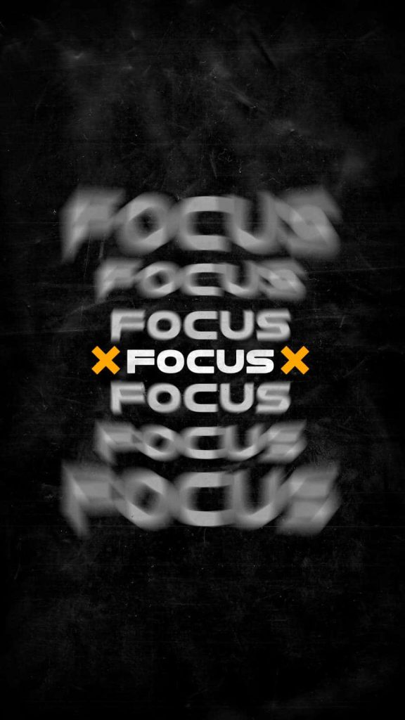 Minimalist digital wallpaper with vertical FOCUS text in sharp yellow on textured black background