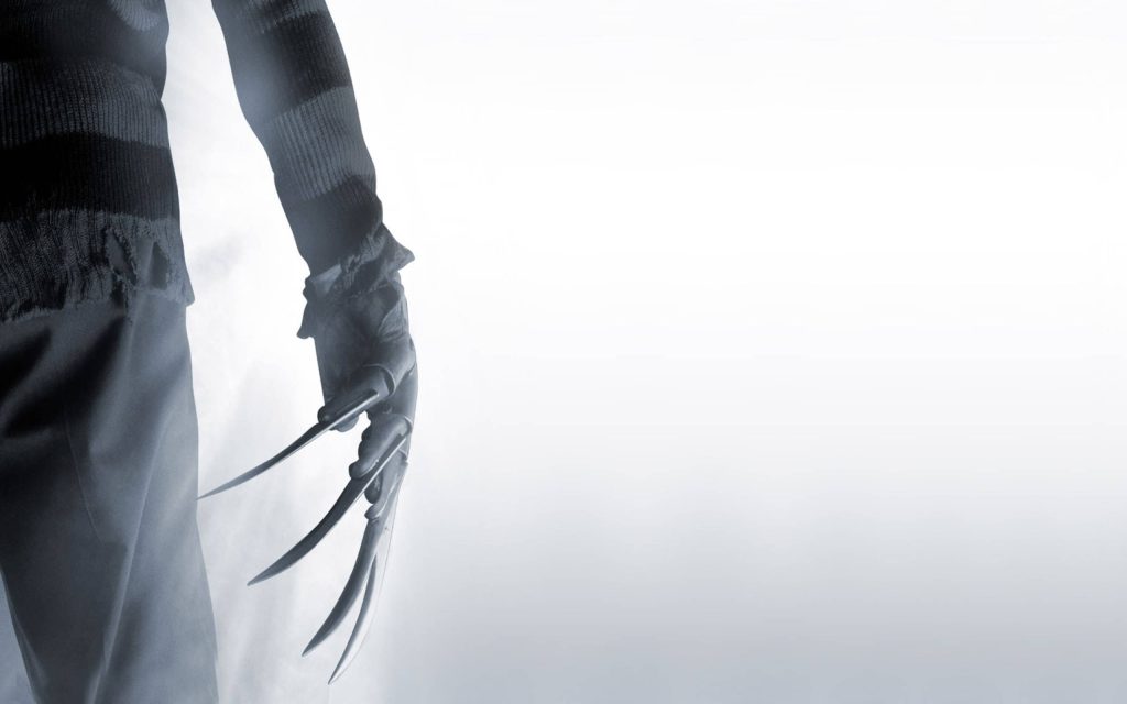 Minimalist Freddy Krueger wallpaper with metal glove and striped sweater on misty white background