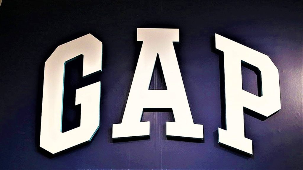 Minimalist Gap classic logo wallpaper with bold white serif letters on navy blue background