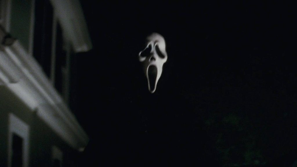 Minimalist Ghostface mask wallpaper with eerie silhouette on black background for horror fans