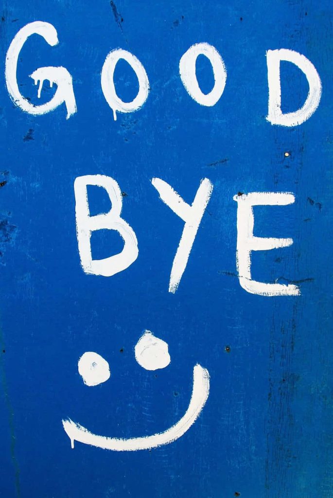 Minimalist wallpaper with white hand-painted goodbye text and smiley on textured blue background