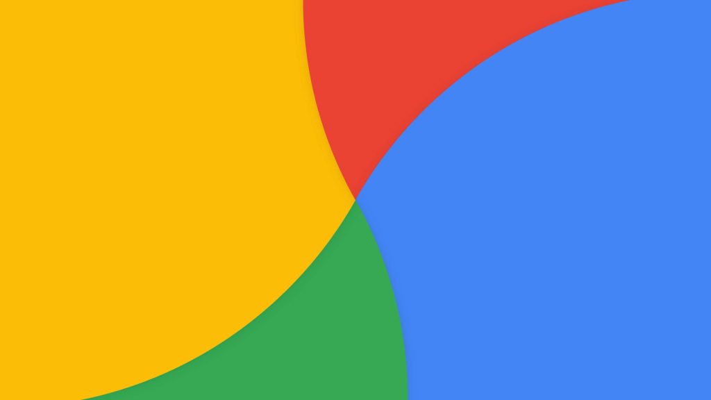 Minimalist Google Drive wallpaper with vibrant curved shapes in yellow red green and blue colors