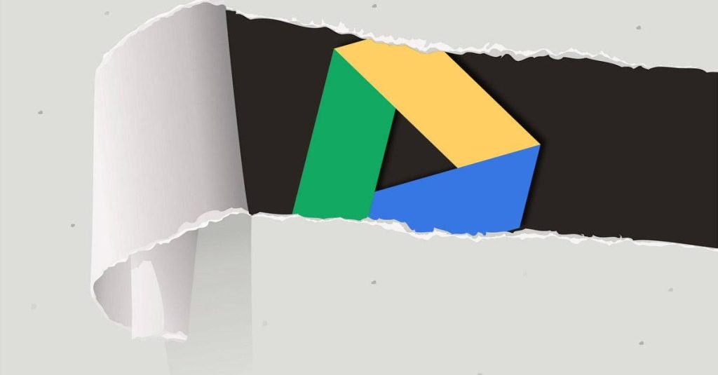 Google Drive logo revealed through torn white paper on light gray minimalist digital wallpaper background