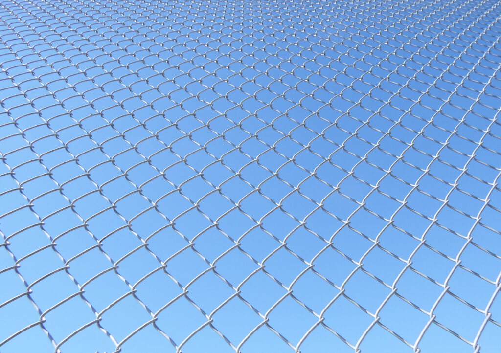 Minimalist Grid Fence Wallpaper Against Clear Blue Sky Background