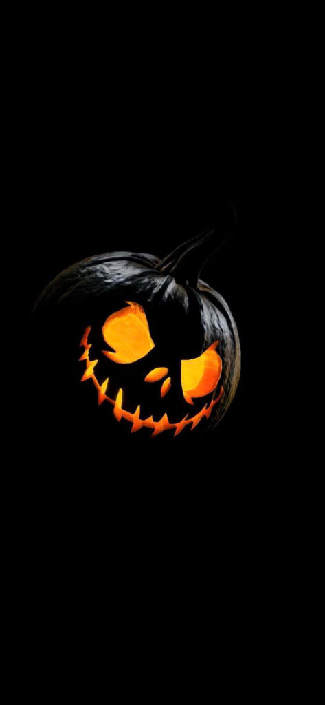 Minimalist Halloween Wallpaper: Glowing Jack-o'-Lantern on Black