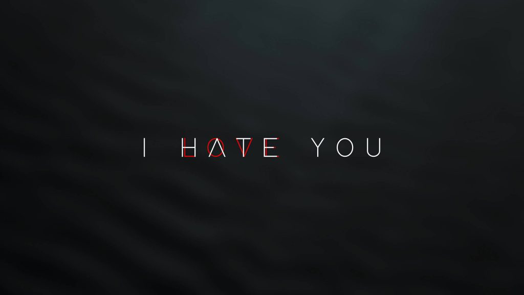 Minimalist digital wallpaper with I HATE YOU text and red triangle on dark textured background