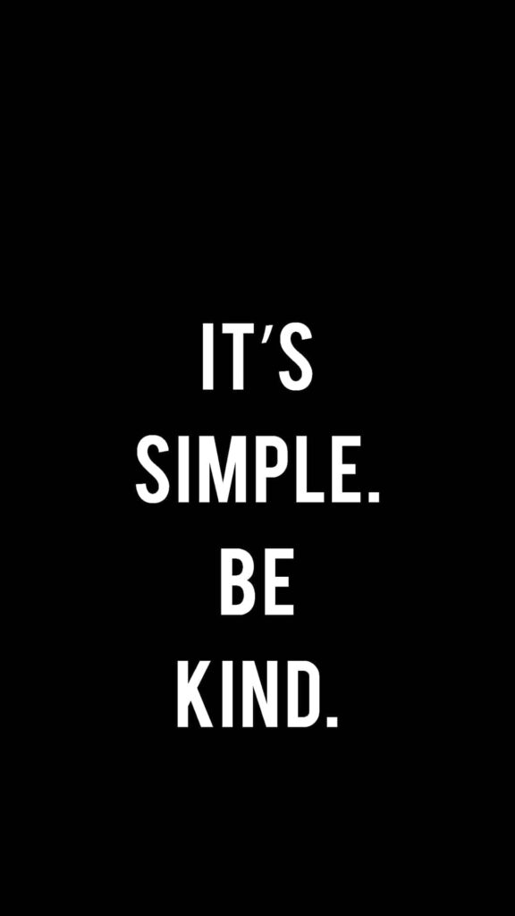 Minimalist wallpaper with bold white text on black background promoting kindness and positivity