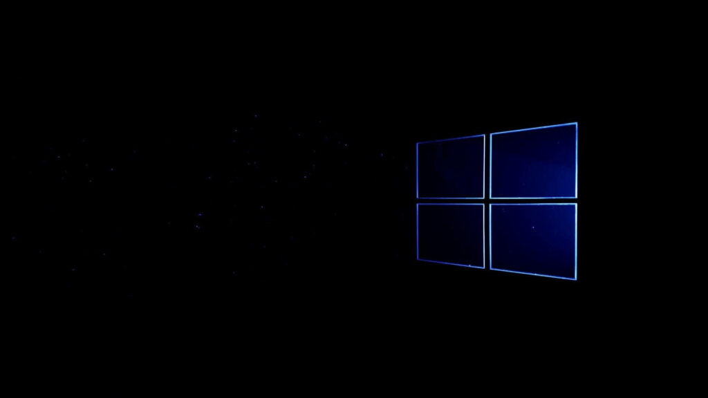 Sleek Logo Embraced by a Shadowscape: Captivating Black Windows 10 HD Background Wallpaper