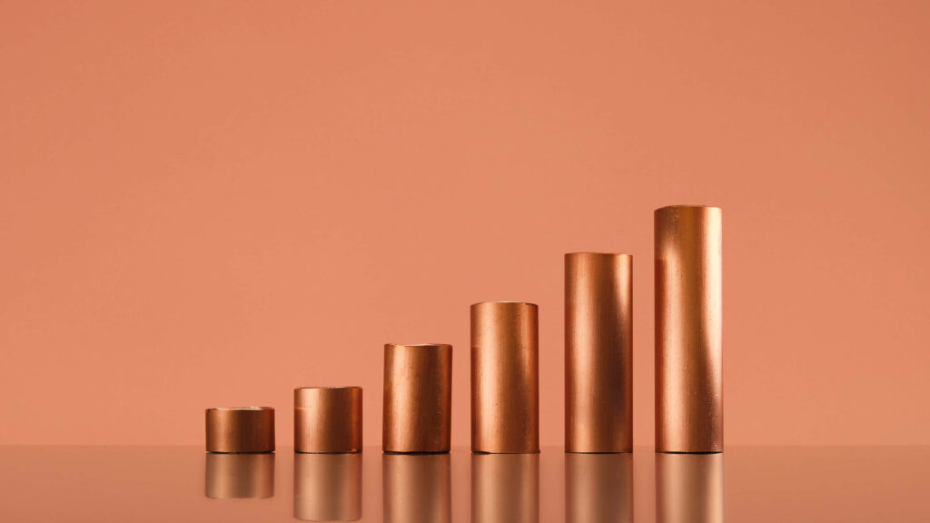 Copper wallpaper with metallic cylinders in varying heights on seamless warm copper background