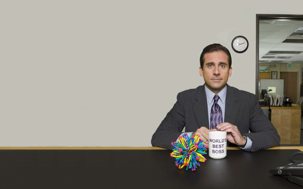 Minimalist Michael Scott Wallpaper: World's Best Boss at His Desk
