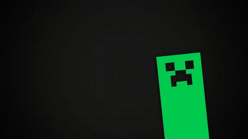 Minecraft Creeper face wallpaper with bold pixel art on a textured black background