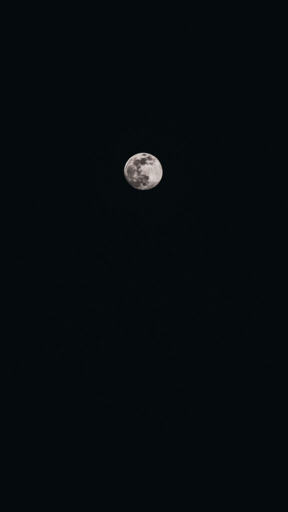 Minimalist Moon Phone Wallpaper on Deep Black Background