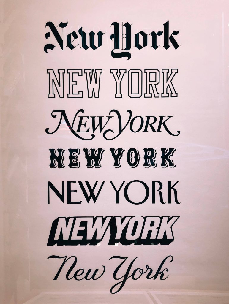 Minimalist New York wallpaper with seven unique font styles including gothic, script, varsity, and 3D