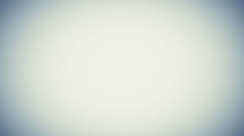 Off-white textured wallpaper with subtle dark vignette framing a clean neutral background