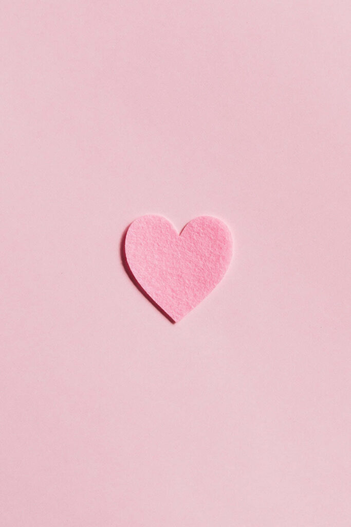 Minimalist Pale Pink Wallpaper with Elegant Heart Cutout Design
