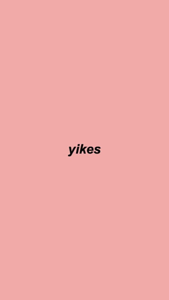 Minimalist Peach Pink Wallpaper with Bold Black 'Yikes' Text