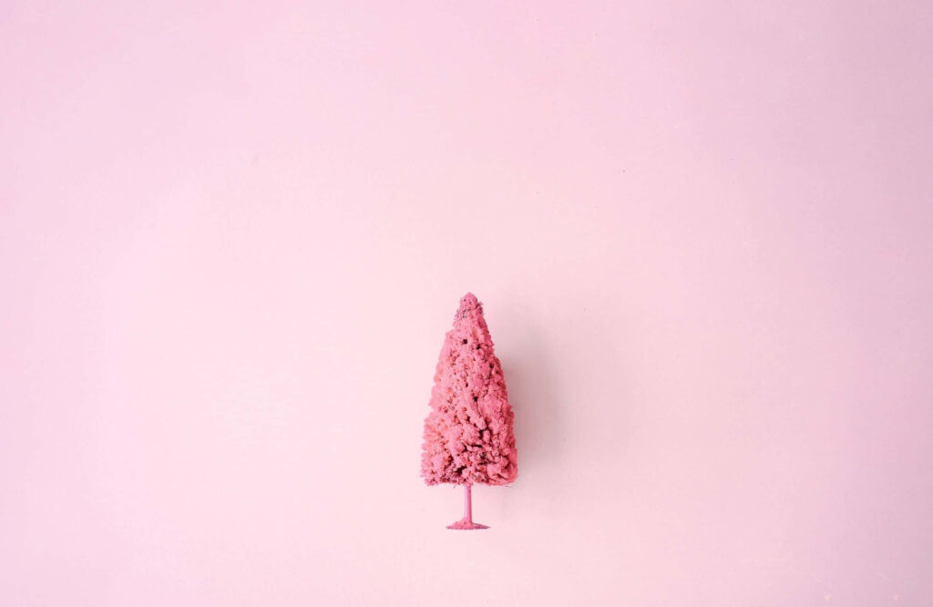 Minimalist Pink Christmas Wallpaper: Stylish Tree & Soft Background
