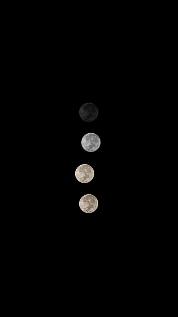 Minimalist pure black OLED wallpaper with four vertical moons on deep black background for dark mode