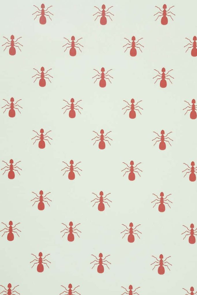 Minimalist fire ant pattern wallpaper with red ants on pale off-white background design