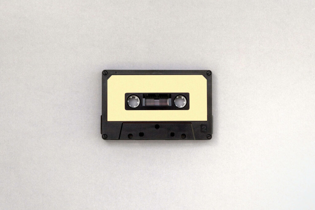 Retro Minimalist Wallpaper: Classic Cassette Tape on Neutral Background