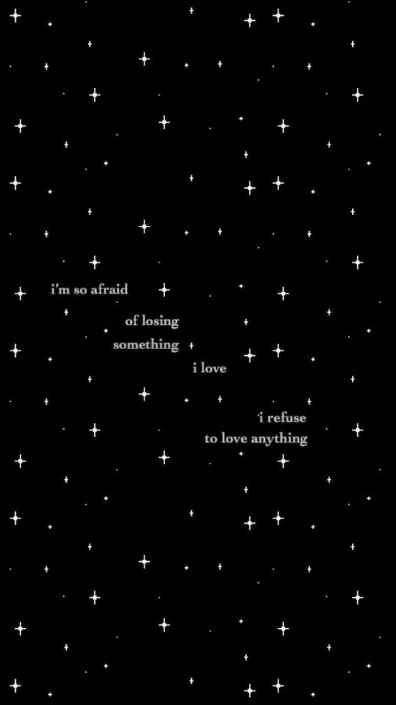 Minimalist sad aesthetic wallpaper with white stars and quote about fear of losing love on black