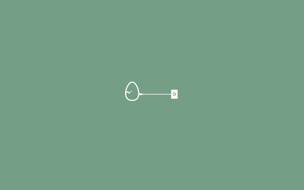 Minimalist sage green wallpaper with cracked egg plugged into wall outlet for calm desktop