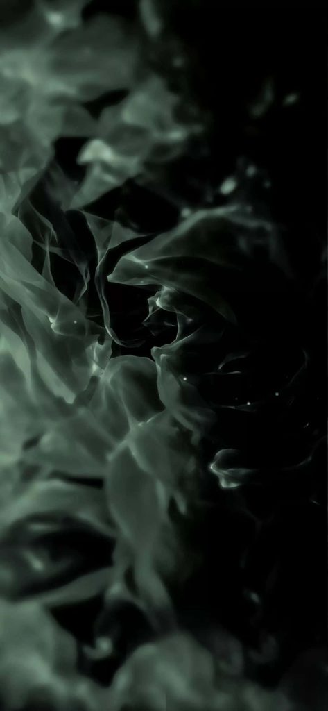 Minimalist abstract iPhone wallpaper with wispy sage green smoke on black AMOLED background
