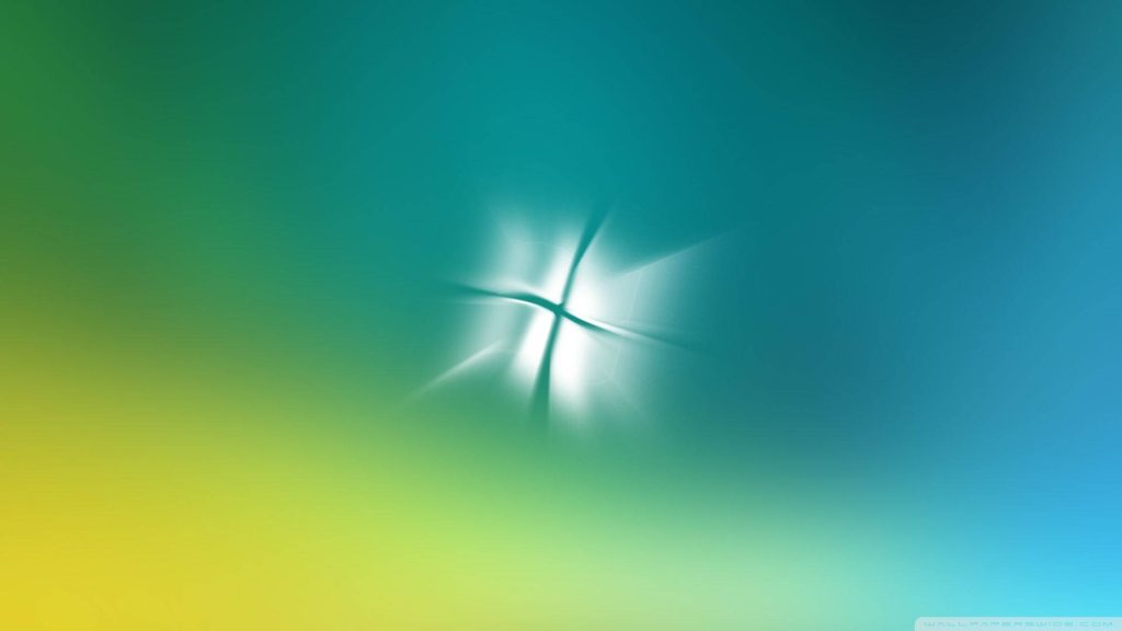 Minimalist sea-colored Windows Vista wallpaper with glowing logo and smooth teal green gradient