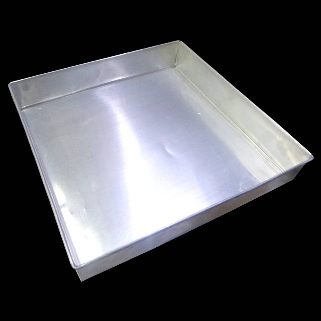 Square silver metal baking pan with sharp lines on black background modern kitchenware Wallpaper