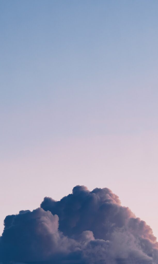 Minimalist wallpaper with soft cloud over serene blue and pink sky for peaceful background