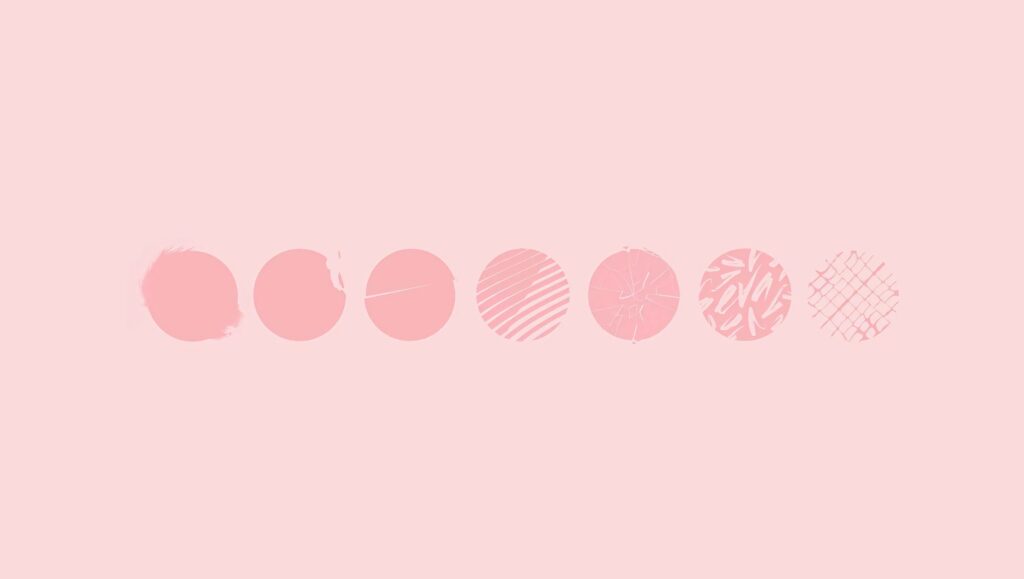 Seven patterned dots fading on soft pink pastel background minimalist calming desktop wallpaper